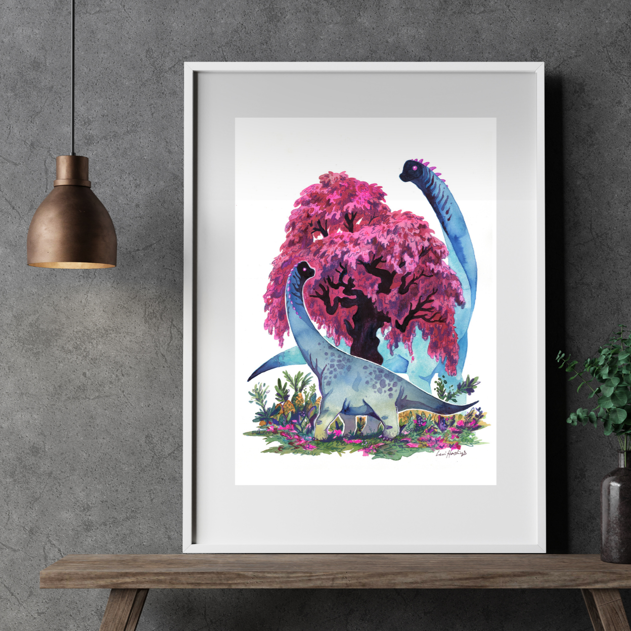 Mockup of a framed artwork depicting two brachiosaurs standing next to a pink-colored maple tree