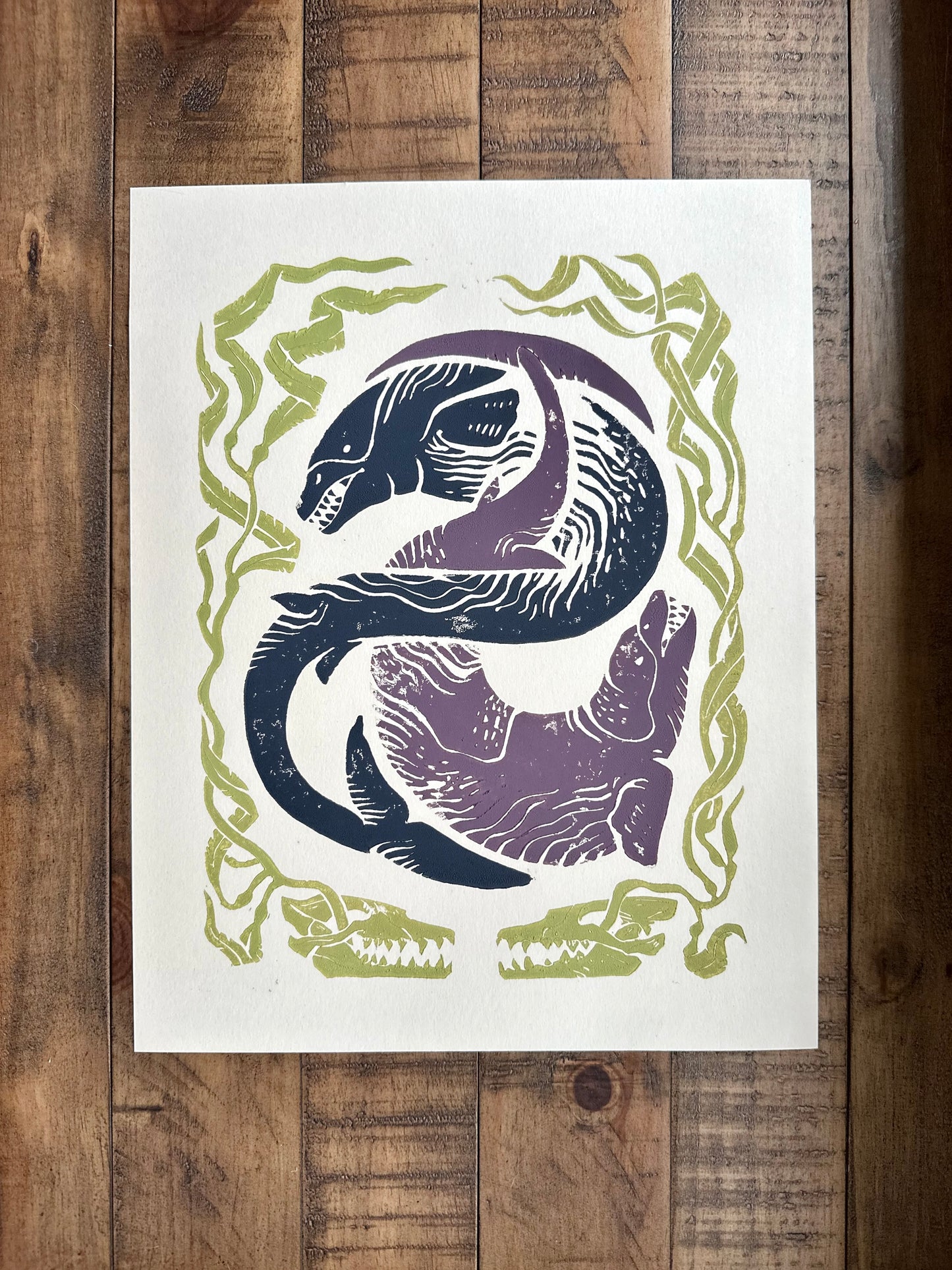 Decorative print with stylized animal designs on a wooden surface