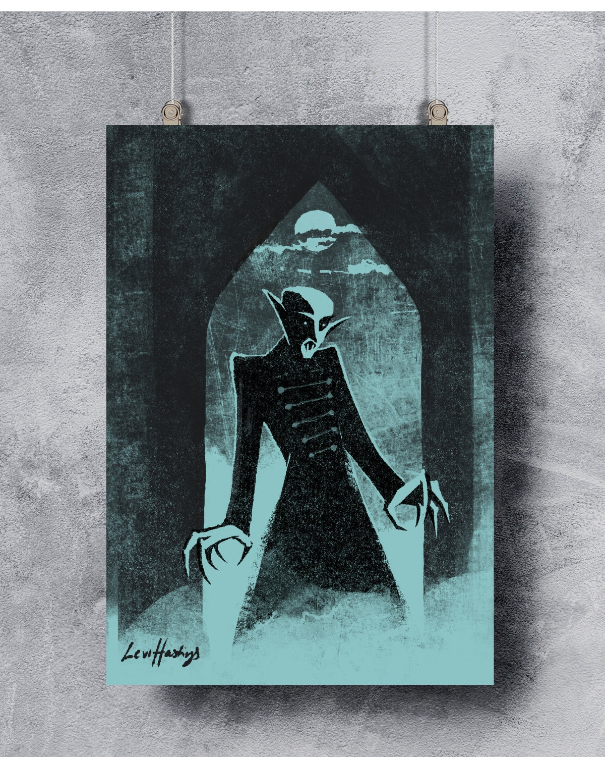 A black and white fine art print of the vampire Nosferatu with a dark background, hung on a wall by two nails.